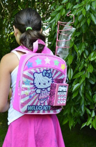 Kylie wears the chemo backpack